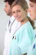 Three medical professionals standing in a line