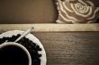 warm cup of coffee on brown background