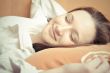 Closeup portrait of young pretty girl laying on her bed