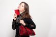 Portrait of a bright beautiful young woman with fashion  handbag