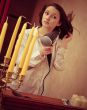Beautiful woman drying her hair with hairdryer