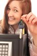 Closeup portrait of young pretty woman at her desk with deposit 