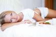 Woman having breakfast in bed. Healthy contin
