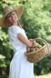young woman with a basket of fruits