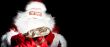 Santa sitting at the Christmas room and looking into the sack