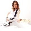 Portrait of beautiful young and attractive womanplaying her guit
