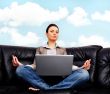 Portrait of young business woman sitting with a laptop"lime