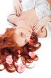 Closeup portrait of a happy young lady lying on </sp