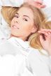 Portrait of young woman laying in bed