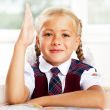 Portrait of a young girl in school at the desk.Horizontal Shot. 