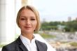 Closeup portrait of cute young business woman smiling