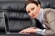 Portrait of a beautiful young woman working on laptop