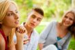 Portrait of three young teenagers laughing and having fun togeth