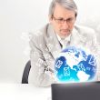 Portrait of an older businessman with a computer and a cup.