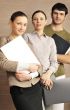 Portrait of three office workers.