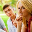 Portrait of three young teenagers laughing and having fun togeth