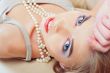 Portrait of gorgeous relaxed young lady with beautiful blue eyes