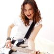 Portrait of young pretty girl who is feeling free and playing gu