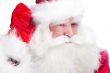 Traditional Santa Claus looking for children and holding his han