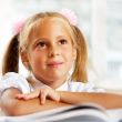 Portrait of a young girl in school at the d<s