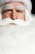 Santa Claus portrait smiling isolated over a black background