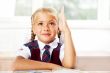 Portrait of a young girl in school at the desk.Horizontal Shot. 