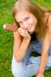 Portrait of young woman eating ice-cream while sitting relaxed o