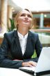 Portrait of a pretty businesswoman sitting at cafe with a laptop