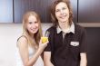 Playful young couple in their kitchen.