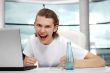 Portrait of handsome young man working with laptop on freelance 