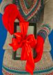 Girl holds electronic book reader with red gloves