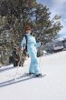 a mature woman doing snow board