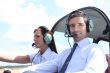 Man and woman in the cockpit of a light aircraft