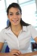 Woman smiling in an office