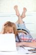 Young woman laid in front of computer