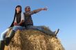 portrait of a couple on a hay bale