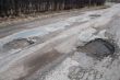 Damaged asphalt road after winter.