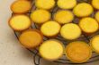 Freshly backed cupcakes on a backing rack. Shallow depth of field