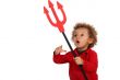 Young child holding up a devil`s fork