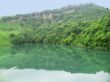 Small lake between the caucasus mountains summertime