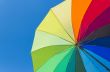 Colorful umbrella on a sky background