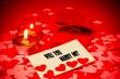 Card with marriage proposal and two rings and two candles