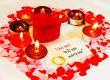 Ring and a card with marriage proposal with candles