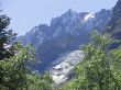 Caucasus mountains and forest under clear blue sky