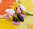 Group of pills on fruit slices ,orange, lemon, lime, grape fruit