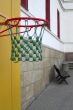 Basketball against a background of an empty school yard