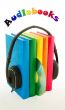 Row of books and headphones - Audiobooks concept