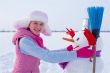 Teenage girl with snowman
