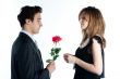 man gives a woman flowers