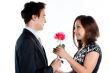 man gives a woman flowers
